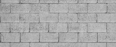 Motif de mur gris en briques de béton