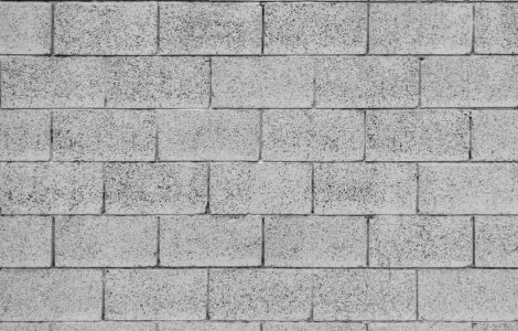 Motif de mur gris en briques de béton