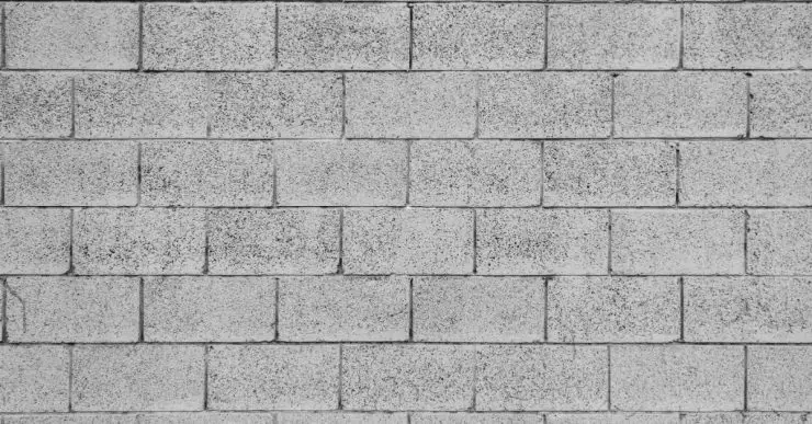 Motif de mur gris en briques de béton