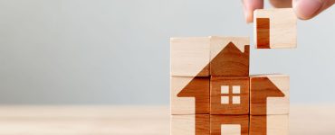 Puzzle de blocs de cube en bois représentant une maison