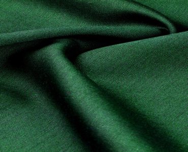 Zoom sur la texture d'un tissu vert
