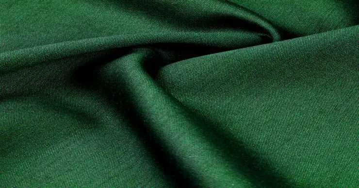 Zoom sur la texture d'un tissu vert