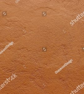 Zoom sur la texture d'un mur en terre cuite