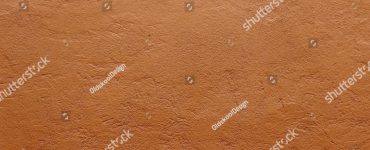 Zoom sur la texture d'un mur en terre cuite