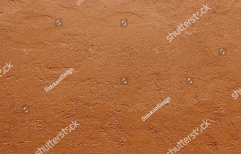 Zoom sur la texture d'un mur en terre cuite