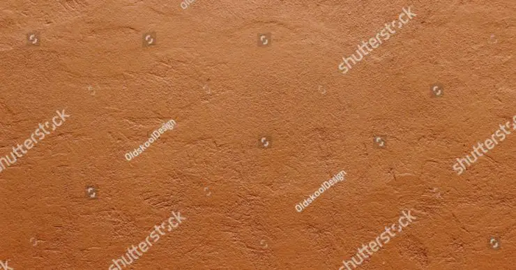 Zoom sur la texture d'un mur en terre cuite