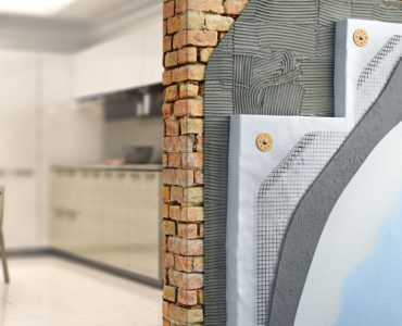 Découpe d'un mur de briques laissant apparaître l'isolation