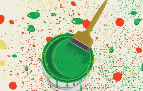 Pinceau dans un pot de peinture verte