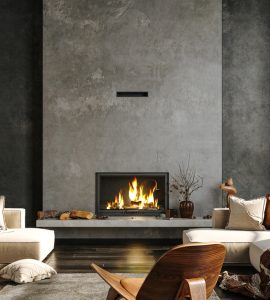 Canapé aux tons beiges dans un salon avec cheminée