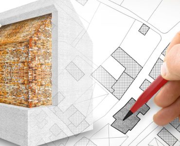 Zoom sur la main d'un homme tenant un crayon et dessinant le plan d'isolation thermique d'une maison